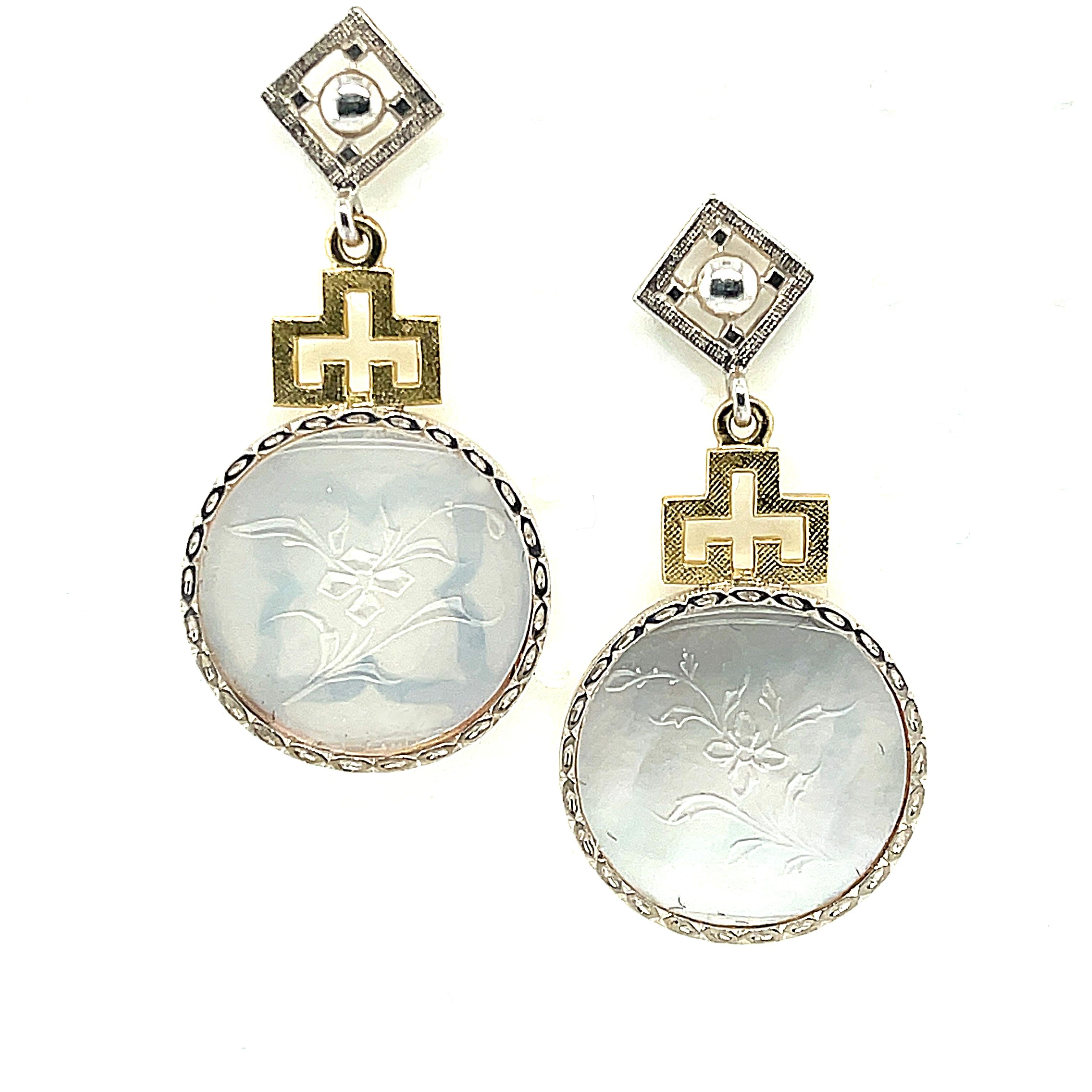 
These beautiful earrings feature antique, mother-of-pearl Chinese gambling counters with motifs dating back to the 18th Century. Originally carved in China for export to Britain, these gaming counters were used like we would use poker chips. Each