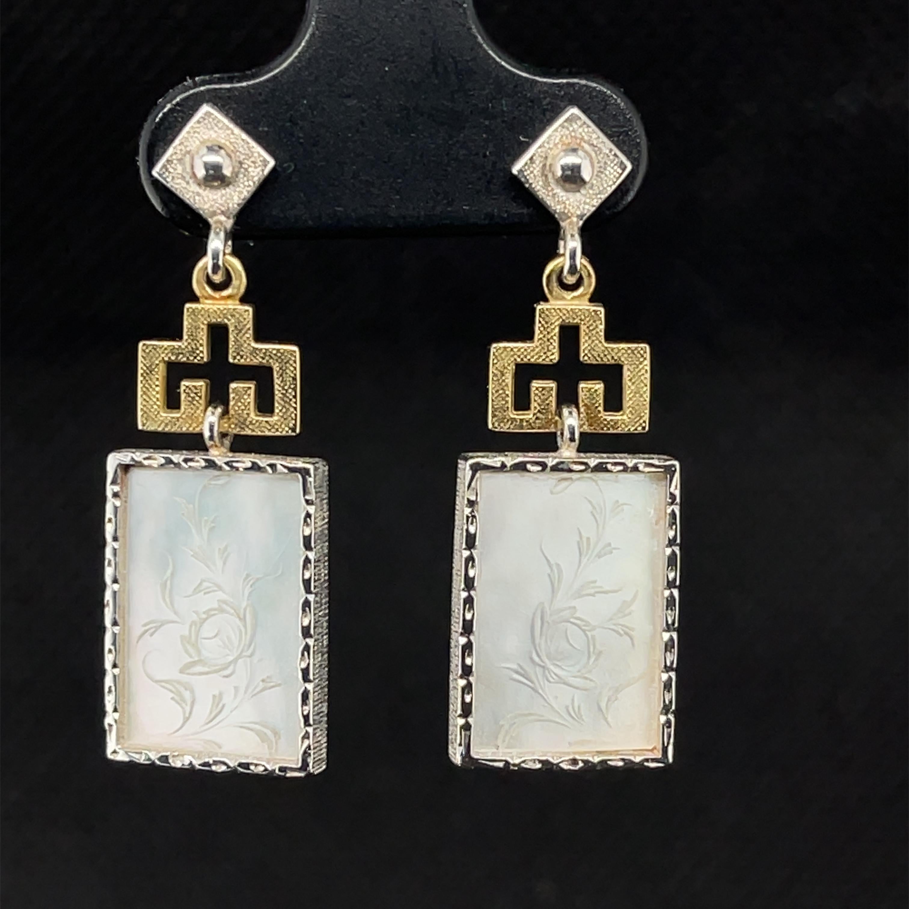 These beautiful earrings feature antique, mother-of-pearl Chinese gambling counters with motifs dating back to the 18th Century. Originally carved in China for export to Britain, these gaming counters were used like we would use poker chips. Each