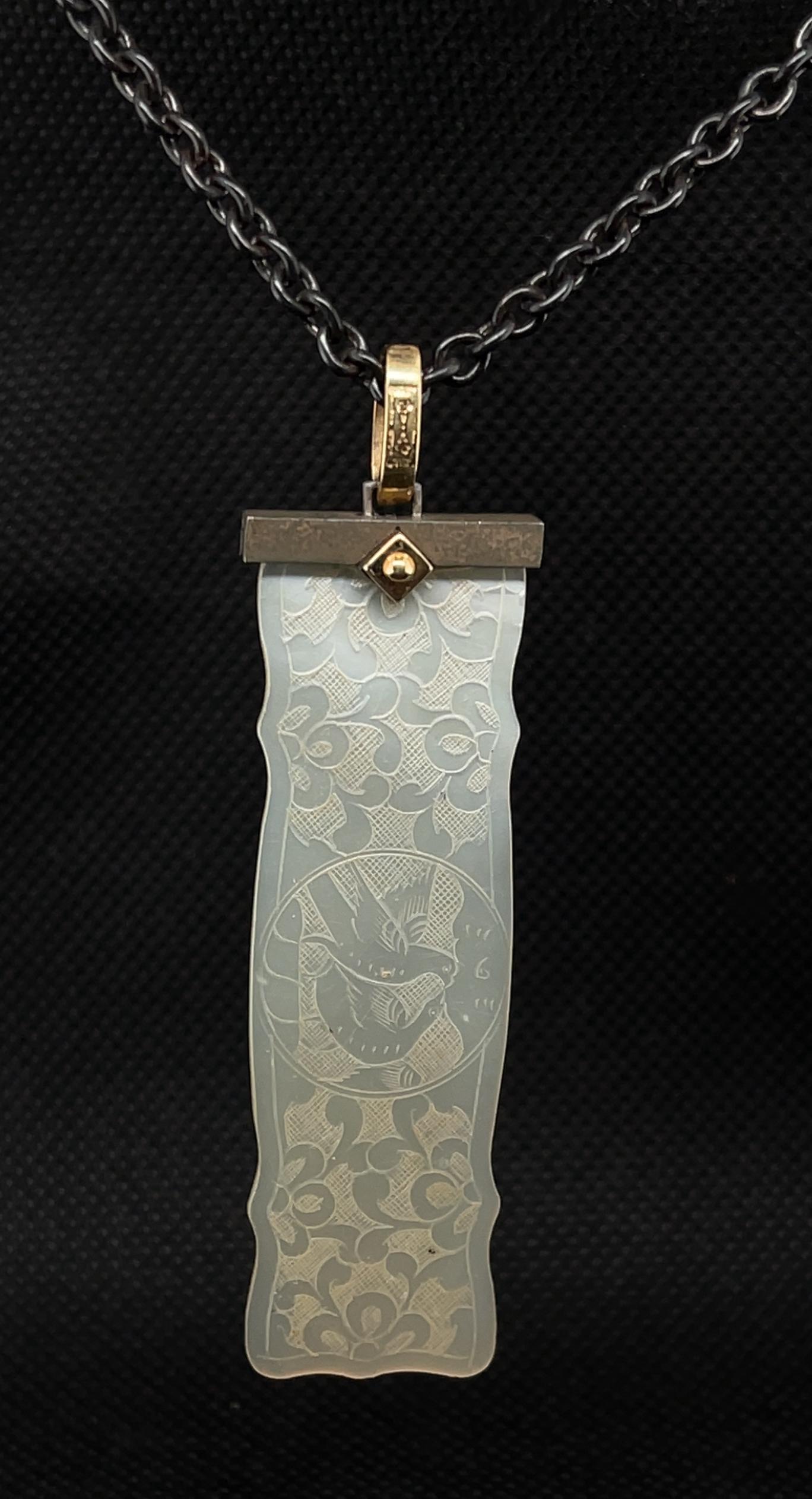 This pretty necklace features an antique, mother-of-pearl Chinese gaming counter dating back to the 18th Century. The elongated rectangular gambling 