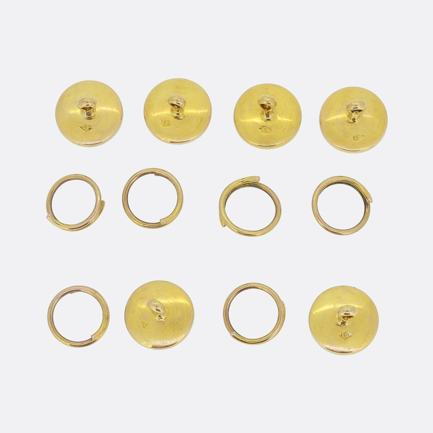 Here we have a handsome gent’s dress stud set comprised of six 13mm diameter mother-of-pearl discs; each set with a single roped cross section at the centre within a warm 15ct yellow gold surround upon matching polished backs. This extremely dapper