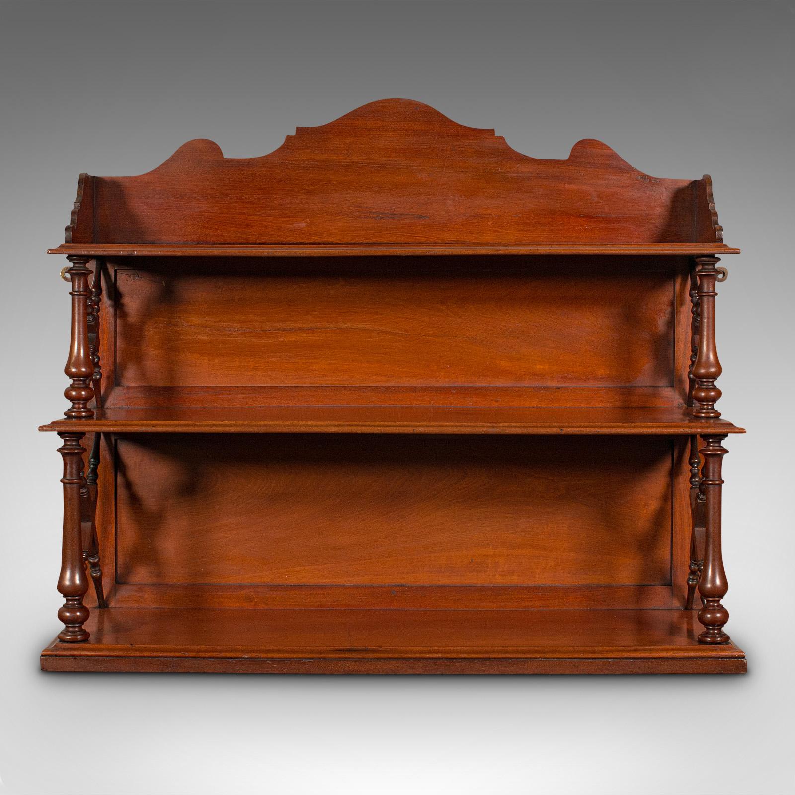 This is an antique mounted whatnot. An English, mahogany wall mounted book shelf, dating to the late Victorian period, circa 1900.

Attractive free-standing or wall mounted display shelves
Displaying a desirable aged patina and in good