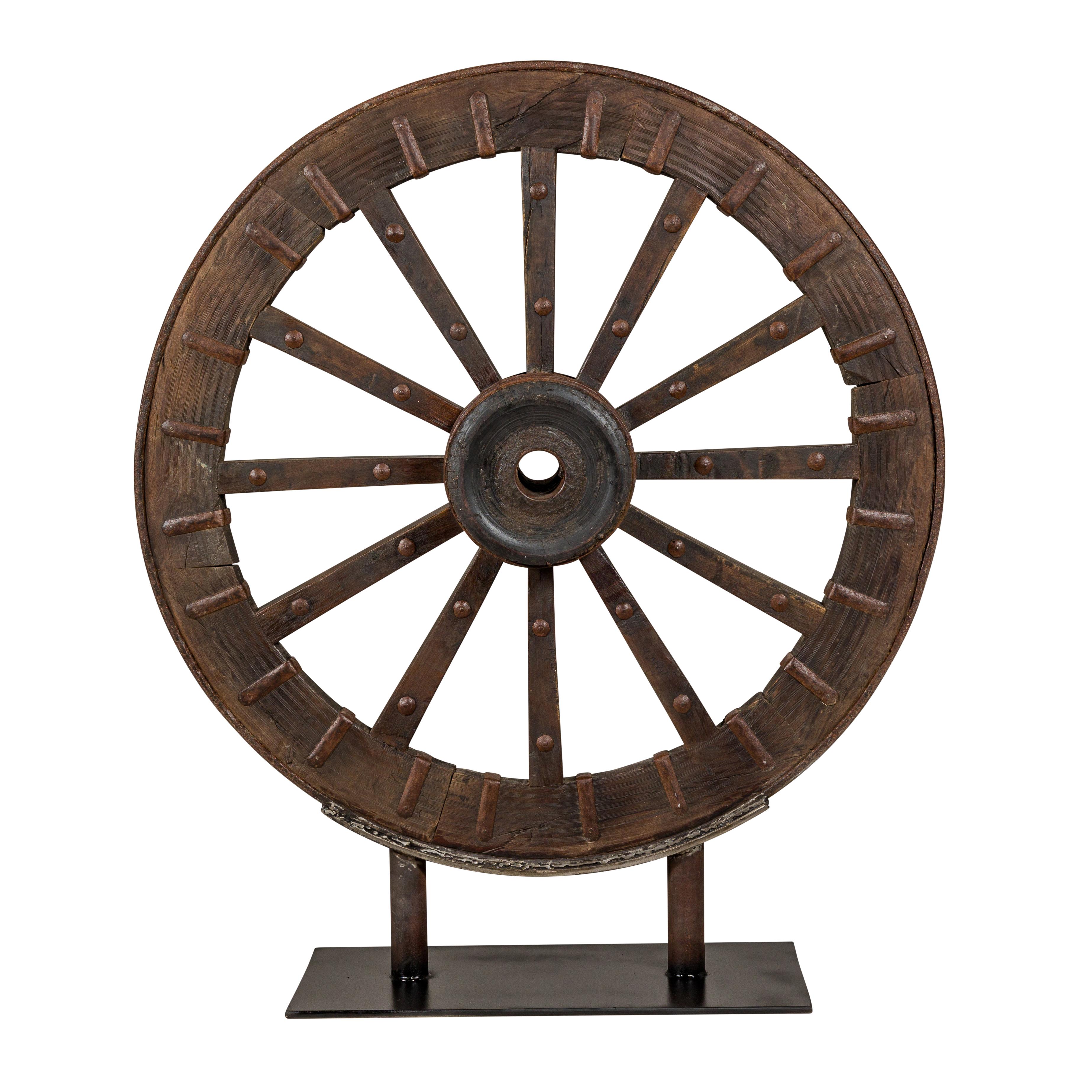 Antique Mounted Wood and Metal Wheel Welded to a Custom Metal Base For Sale 8