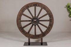 Antique Mounted Wood and Metal Wheel Welded to a Custom Metal Base