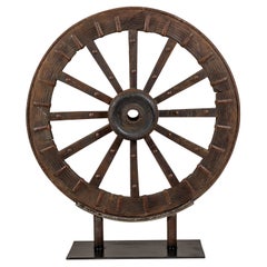 Used Mounted Wood and Metal Wheel Welded to a Custom Metal Base