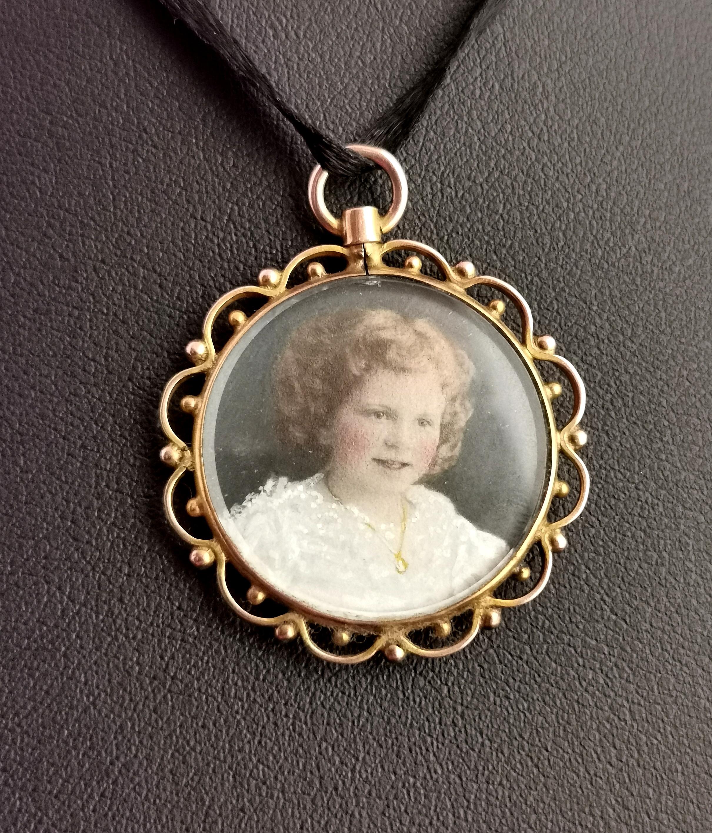 A gorgeous antique, Victorian 9 karat yellow gold portrait miniature mourning pendant.

A tragically beautiful piece created in memory of a beautiful young girl.

The pendant locket is a circular shape with glazed panels front and back, it has a