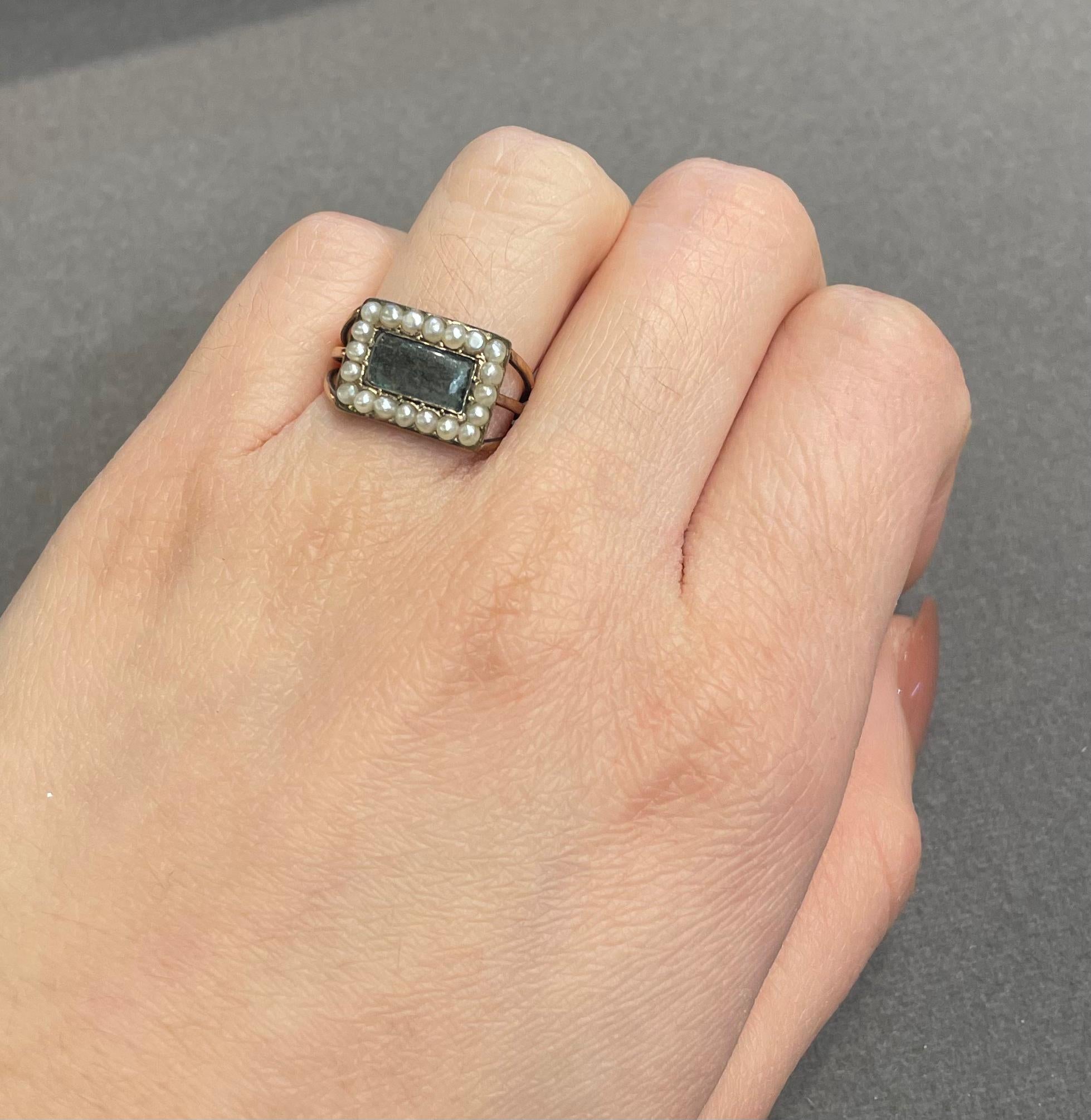 Antique Mourning Ring

A yellow gold mourning ring with 20 pearls. 

Circa: 19th century 
Ring Size: 5.25
Complimentary resizing 
Metal Type: 14 karat gold

