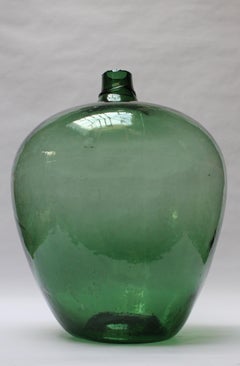 Demijohn bulbeux en verre soufflé à la bouche d'antiquités vert émeraude