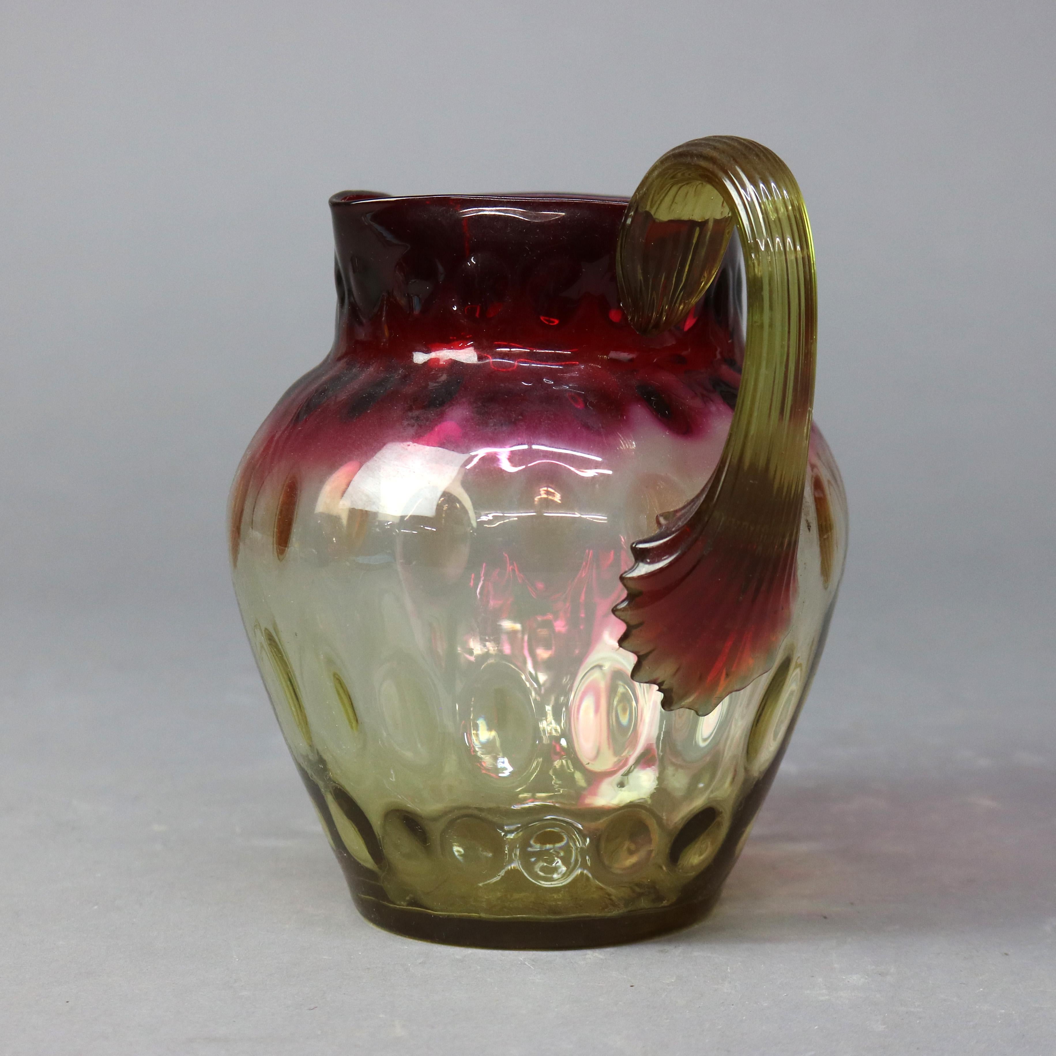Antica brocca per acqua o per succo di frutta di Mt. Washington School in vetro da mirtillo rosso ad ambra Coinspot c1890

Misure: 7