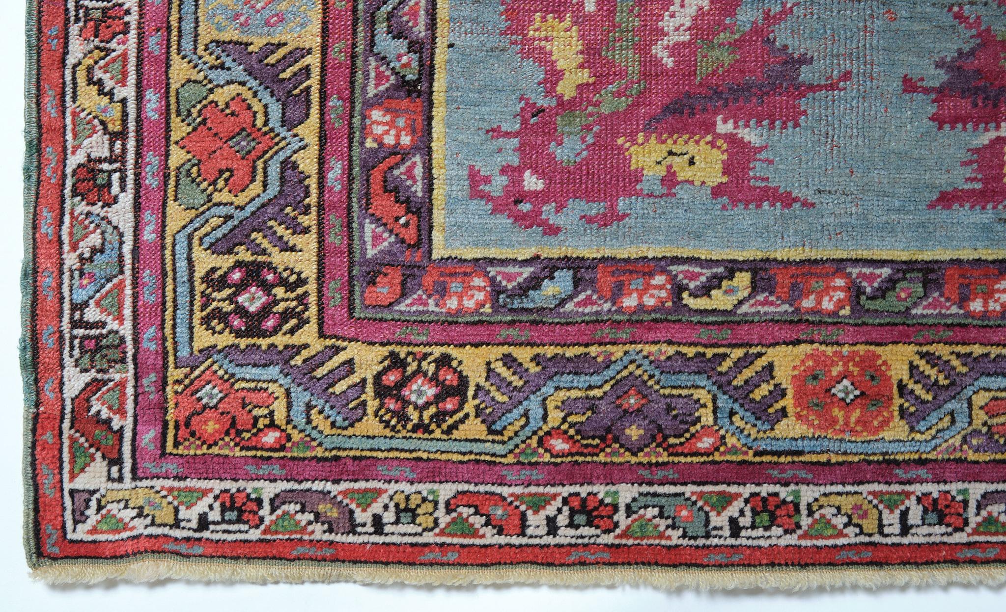 This is an antique Mucur Rug from Central Anatolia, the Kirsehir region with a floral pattern, good condition, and beautiful color composition. 

The town of Mudjar (or Mucur) is about twenty miles southeast of Kirsehir. The area has a long