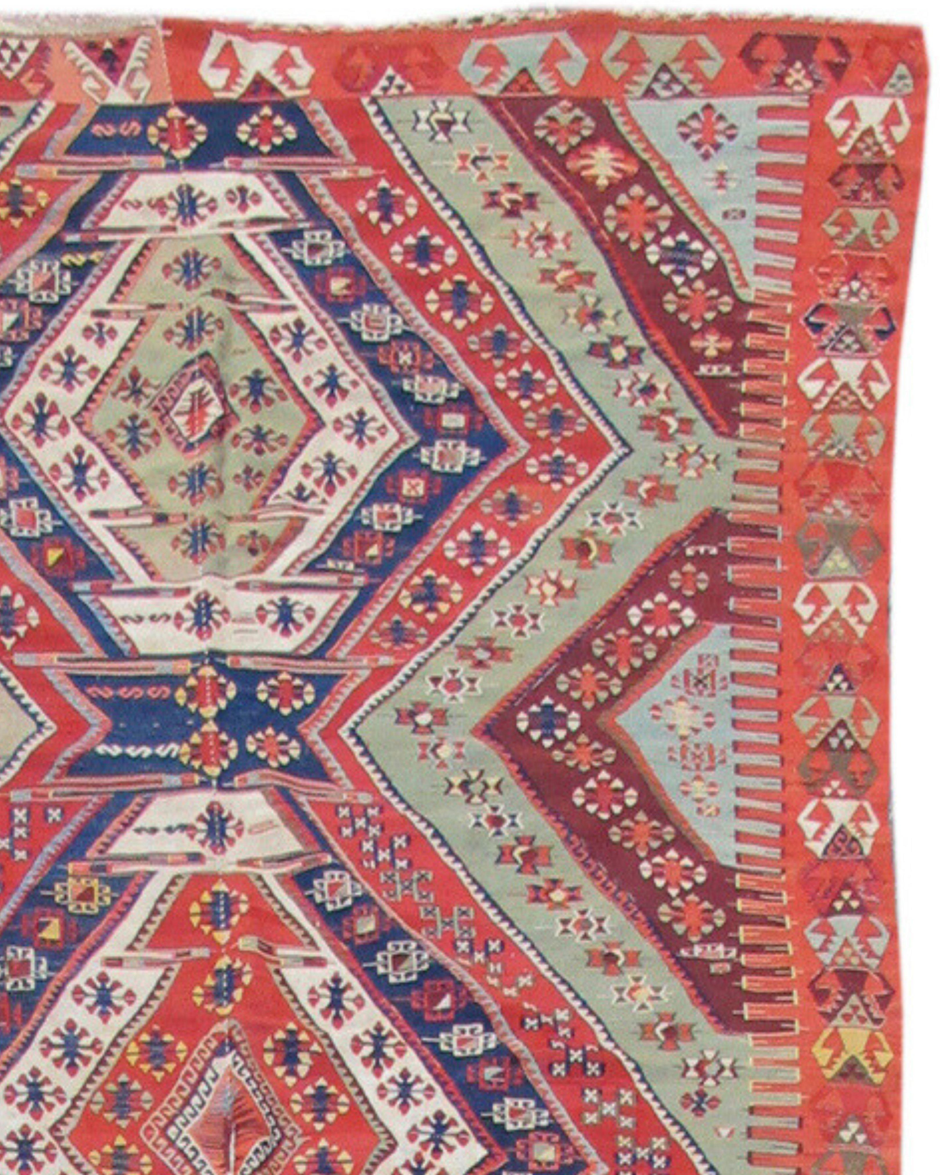 Antique Multi-Colored Anatolian Kilim Rug, Mid-19th Century 

This Reyhanli Kilim from the Kurdish region of Southeastern Anatolia is woven with a rainbow of colors. There are several distinct shades of blues, greens, reds and orange. Indeed, the