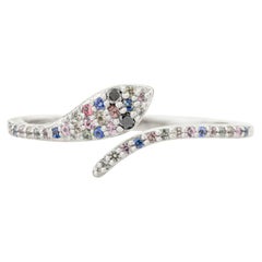 Bague enveloppante serpent ancienne en or blanc 18 carats sertie de plusieurs saphirs et de diamants