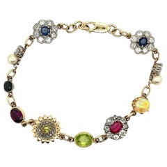 Conjunto de pulsera antigua con varias piedras en oro amarillo de 8 ct y plata