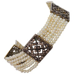 Bracciale antico con perle e diamanti in argento e oro bianco con filigrana