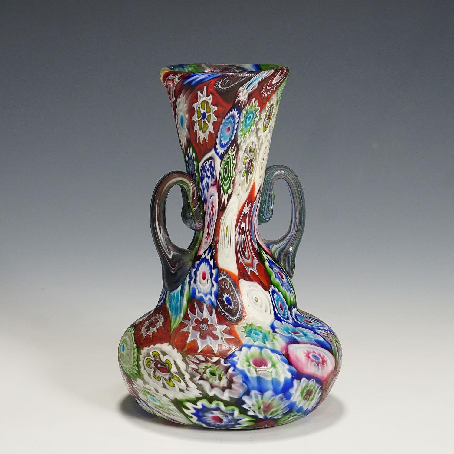 Antique Multicoloured Millefiori Vase with Handles, Fratelli Toso Murano 1910

An antique Millefiori murrine glass vase manufactured by Vetreria Fratelli Toso, Murano around 1910. Made of multicoloured murrines which where melted together. Surface