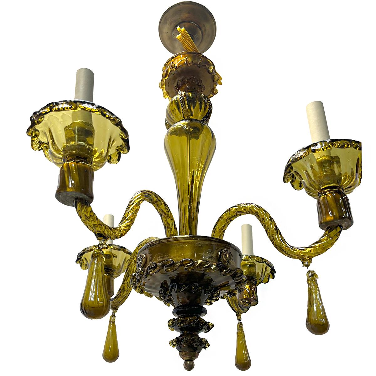A circa 1920's Italian green blown glass chandelier with 4 arms, 4 candelabra lights.

Measurements:
Diameter: 24