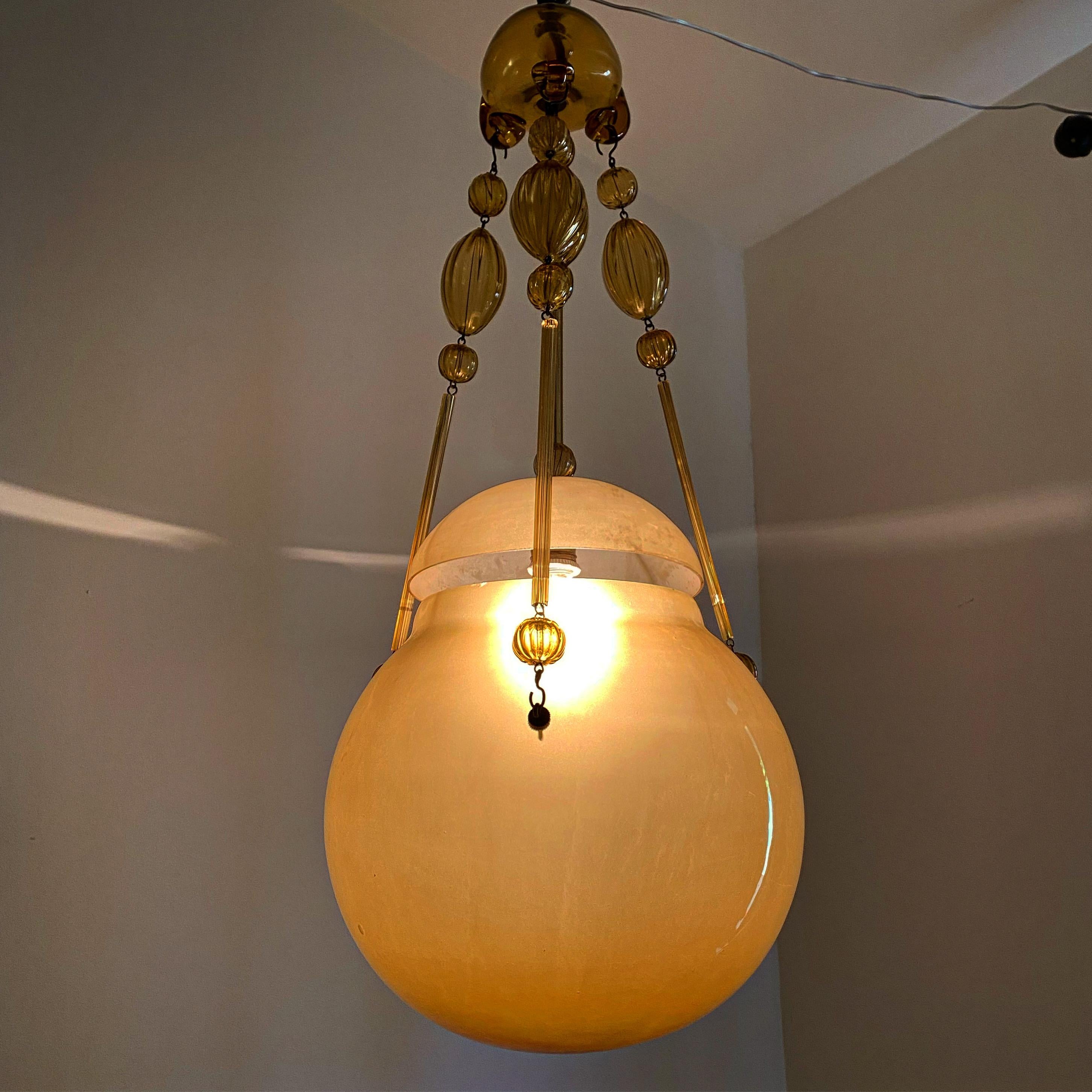 Beautiful and Large pendant lantern in hand blown amber Murano glass and brass.
The quality of the glass points to one of the major factories like Venini or AVEM, in Murano but we have not yet been able to attribute it.
Measures: Total height is
