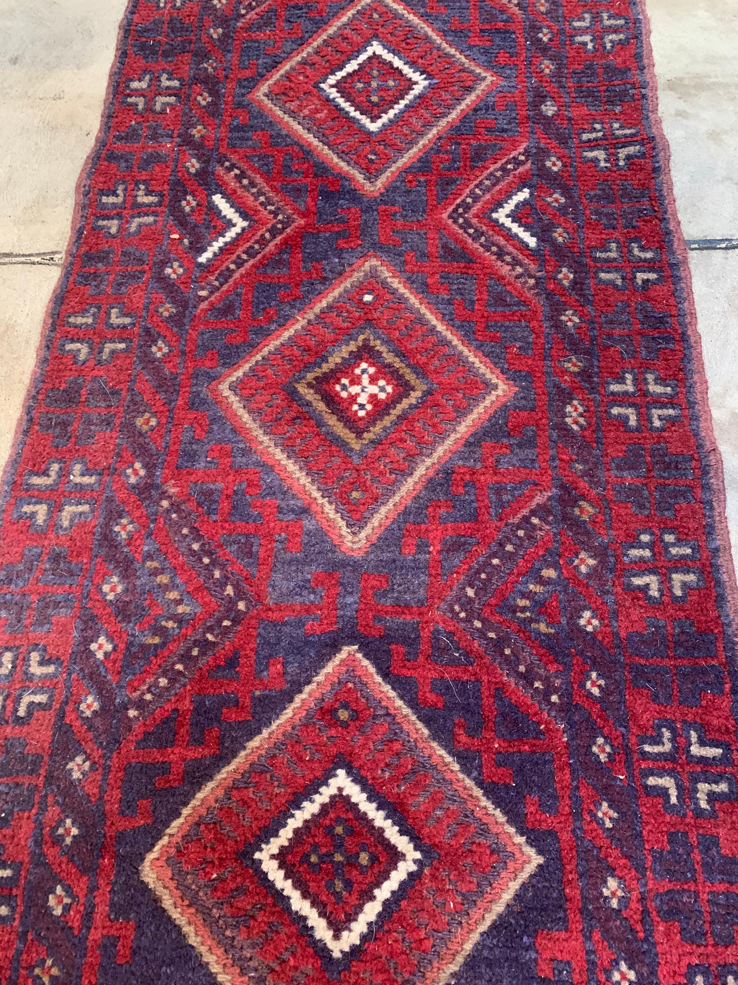 Offered is a antique Mushani style rug runner. This runner is in great condition. The colors are vibrant and there is no visible fading.

 