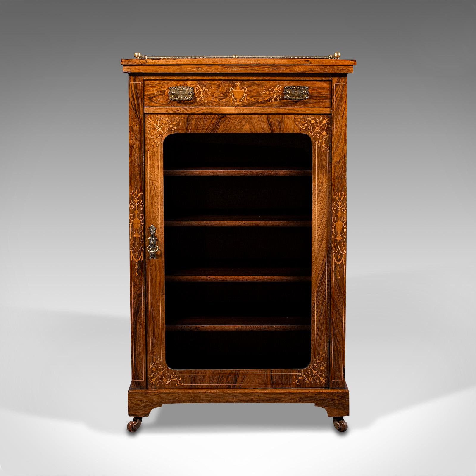 This is an antique music cabinet. An English, rosewood glazed display case with boxwood inlays dating to the late Victorian period, circa 1900.

Superior quality with a highly attractive finish
Displays a desirable aged patina throughout
Select