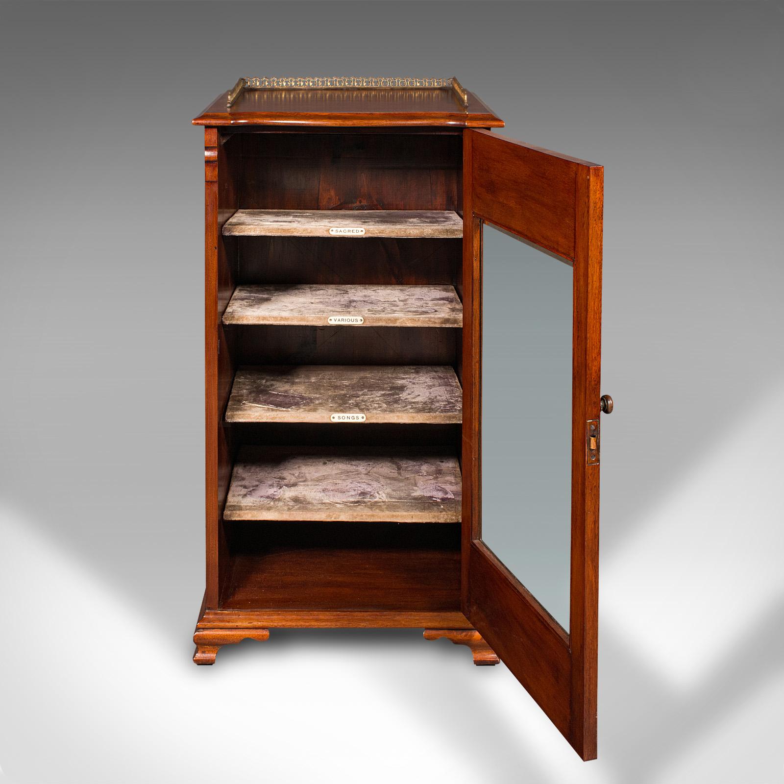 This is an antique music cabinet. An English, walnut and glass display case or bookcase, dating to the Edwardian period, circa 1910.

Of delightful quality with a highly attractive finish
Displays a desirable aged patina and in good order
Select