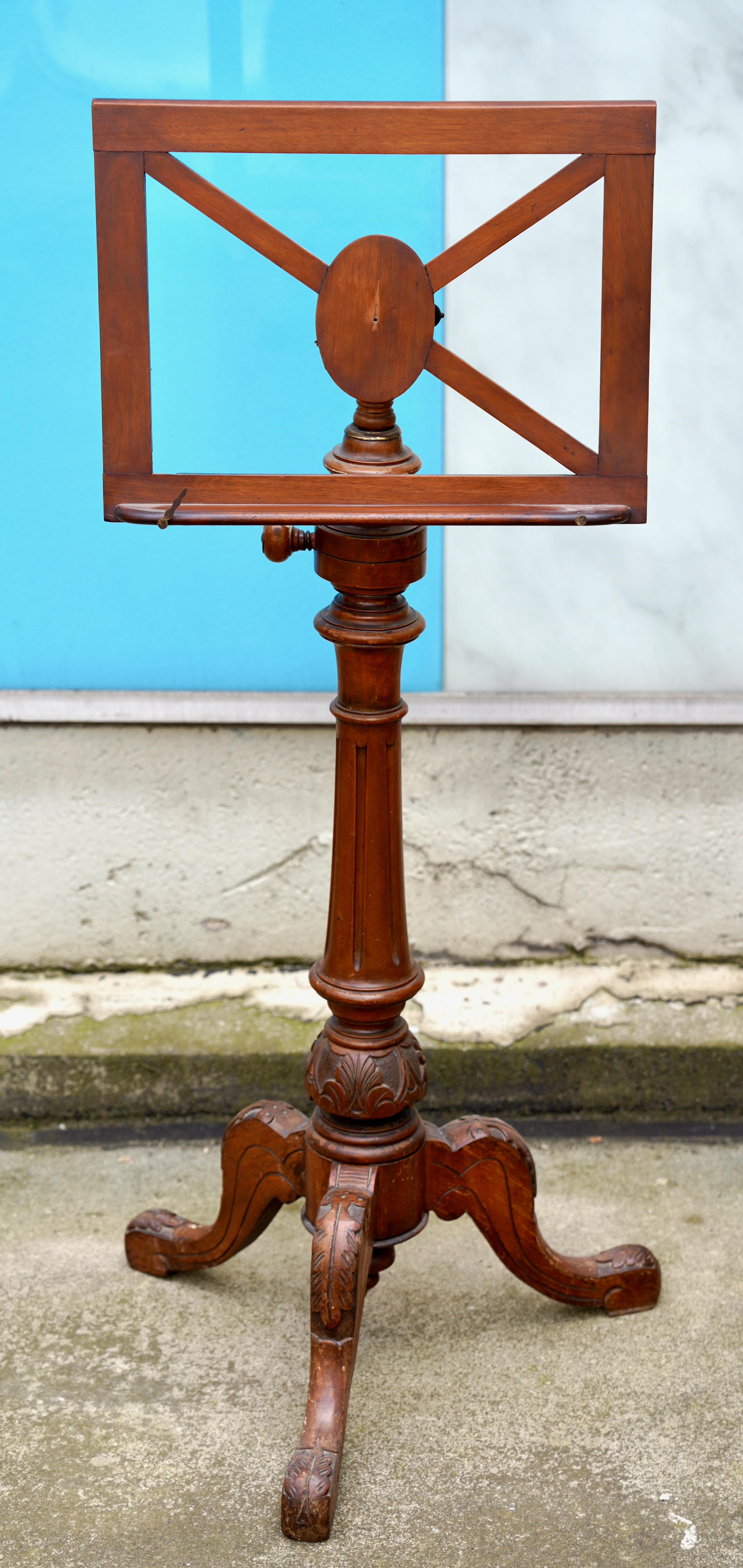 Antique music stand from the 19th century

This antique music stand dates back to the 19th century and represents the craftsmanship and design aesthetics typical of the time.

The stand is made of finely carved wood with detailed ornaments showing
