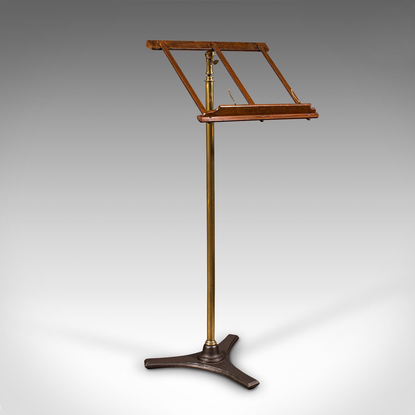 This is an antique music stand. An English, walnut and brass adjustable recital or lectern rest, dating to the Victorian period, circa 1870.

Host your sheet music or speeches from this elegant, adjustable rest
Displays a desirable aged patina