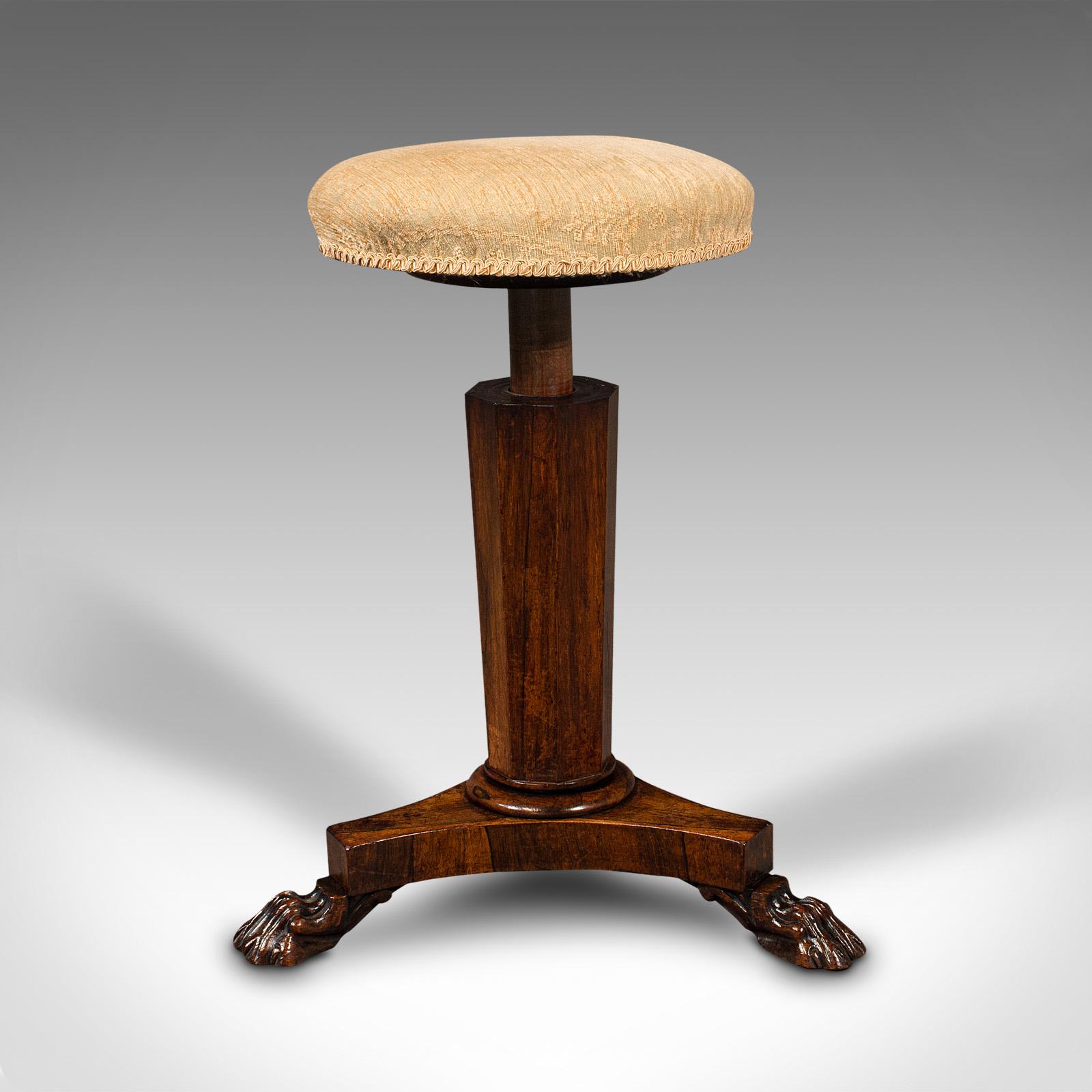 This is an antique music stool. An English, rosewood adjustable piano recital stool, dating to the Regency period, circa 1820.

Attractive music stool with adjustable height and fascinating form.
Displays a desirable aged patina and in very good