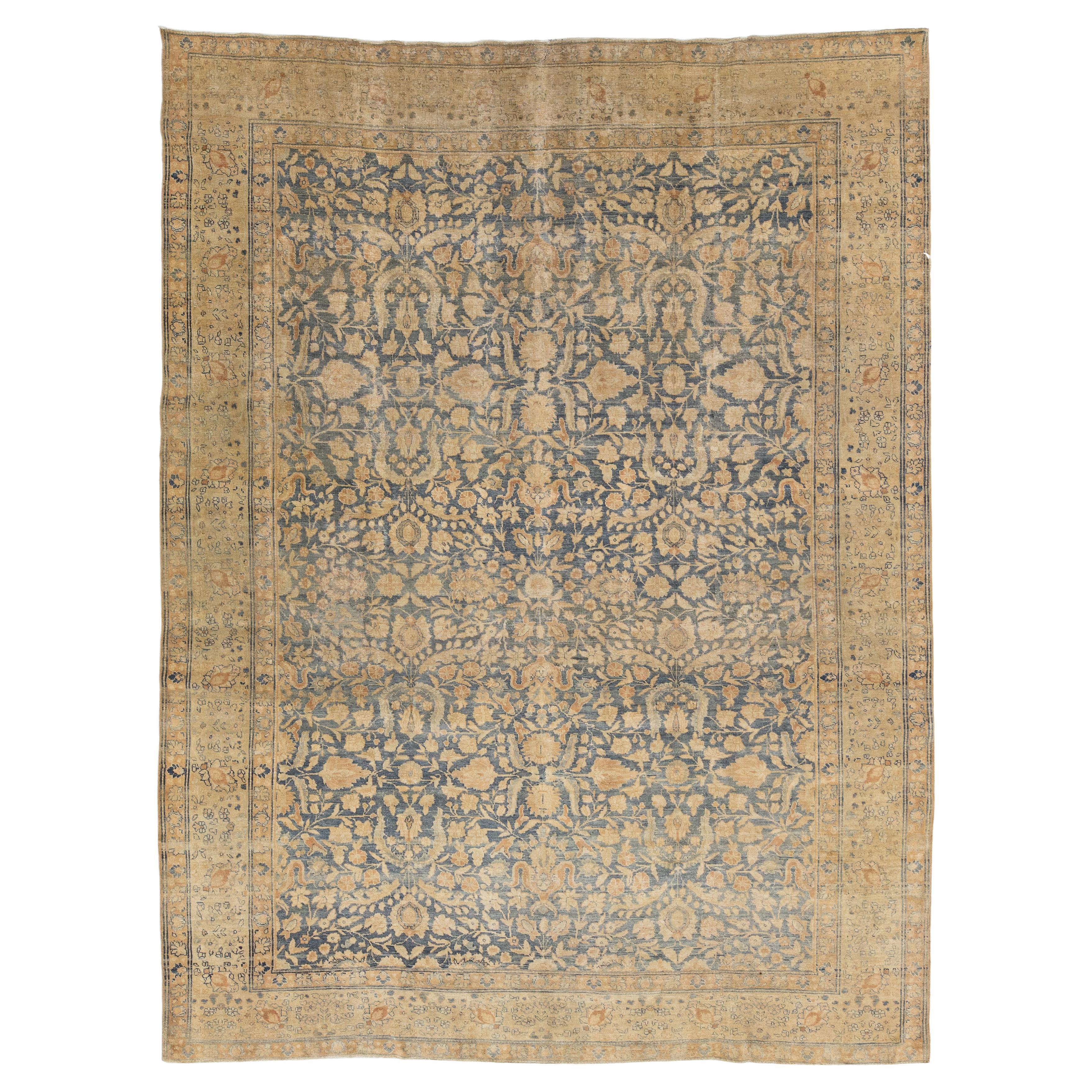 Antique Muted Tabriz Area Rug – 1900s Persian Wool Rug with Arabesque Motif For Sale