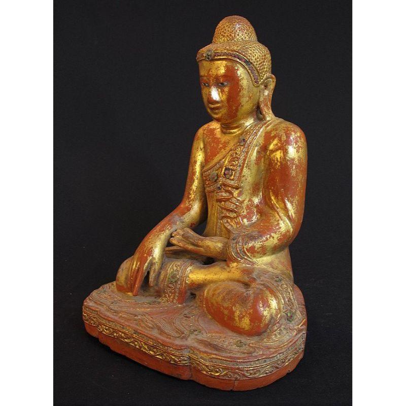 Material: wood
40 cm high 
30 cm wide
Weight: 4.6 kgs
Mandalay style
Bhumisparsha mudra
Originating from Burma
19th century
Goldplated with 24 krt. gold

