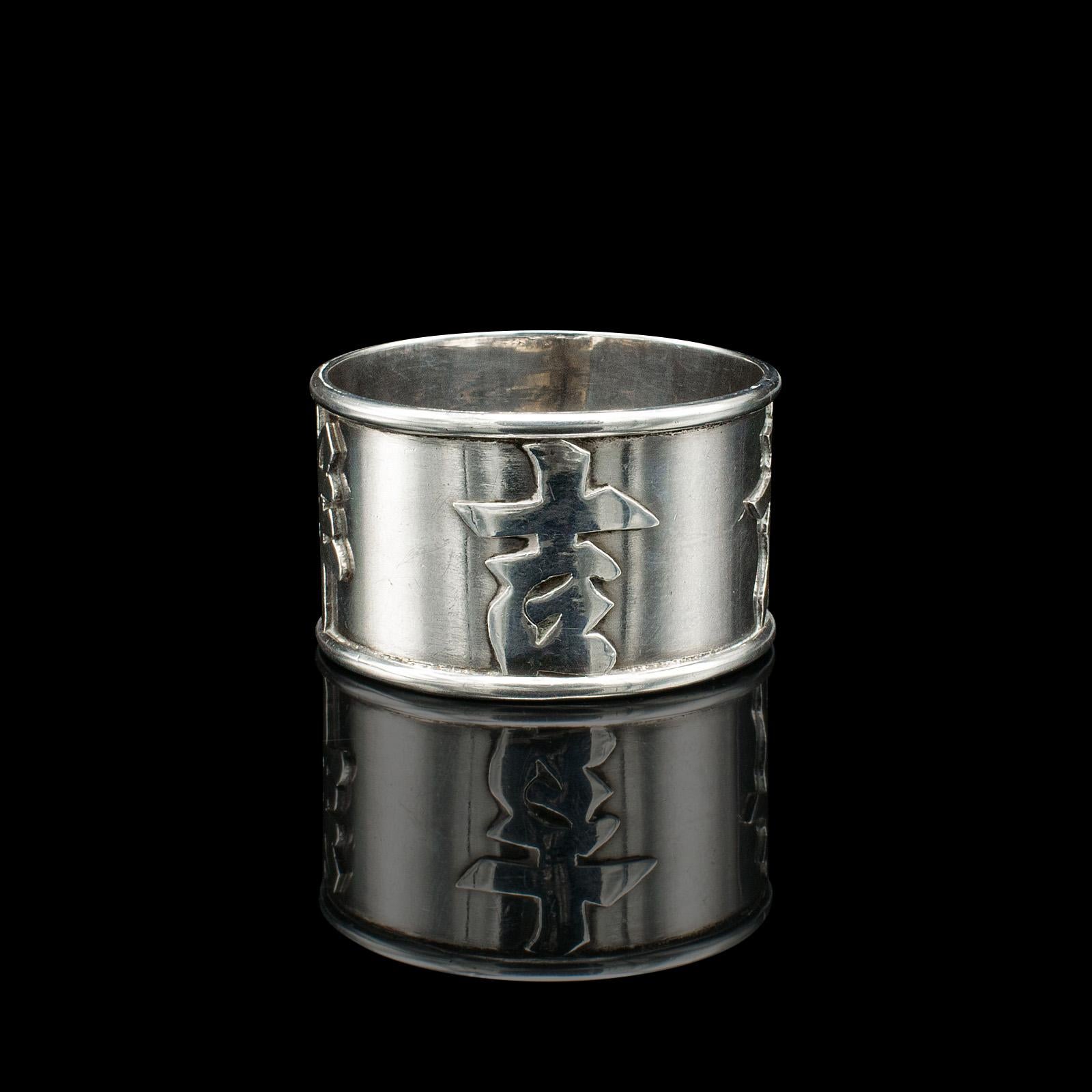 This is an antique personalised napkin ring. A Chinese, silver decorative holder, dating to the late Victorian period, circa 1900.

Fascinating relief finish with personalised appeal
Displays a desirable aged patina and in good order
Silver presents