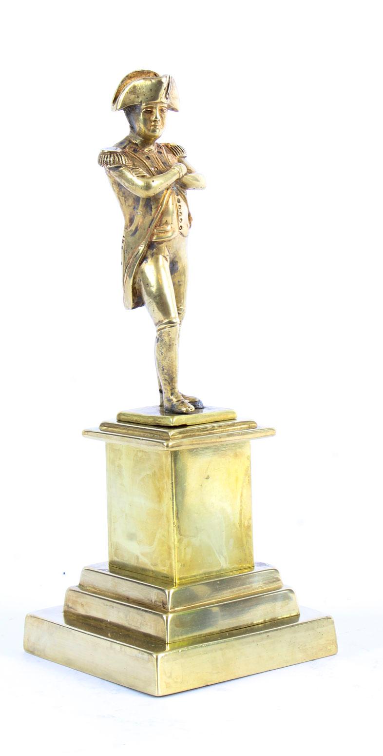 This is a highly collectable polished bronze desk model sculpture of the Emperor Napoleon Bonaparte, dating from the 19th Century.
 
This beautiful bronze features Napoleon Bonaparte in his uniform, standing in a conventional pose by crossing his