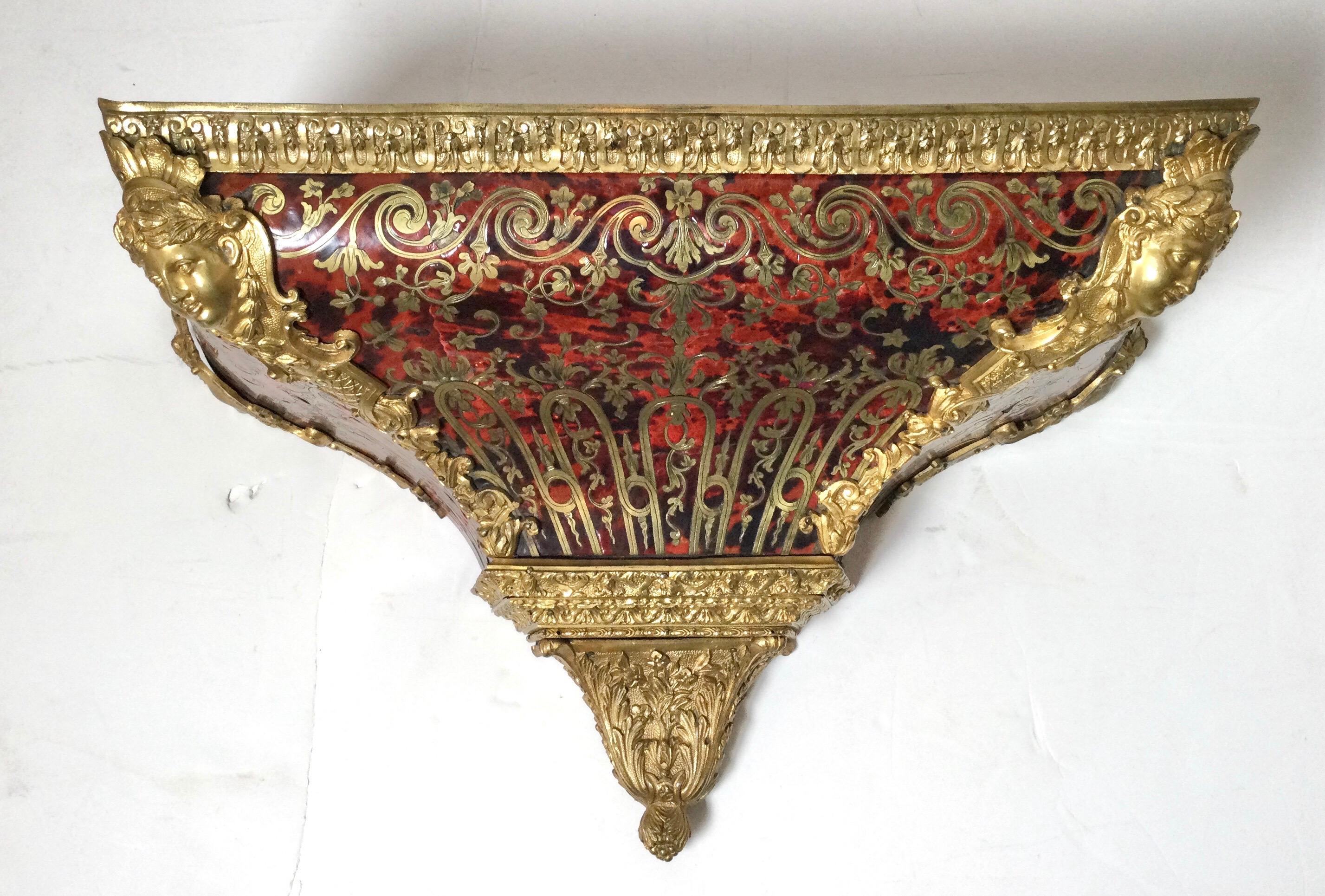 Louis XV Large wall console wall shelf cabinet for a table clock, made in Boulle style Marquetry, 19th century.
Made in brass on a red tortoiseshell background, very beautiful ornaments in bronze. The top is in raw blackened wood as well as the
