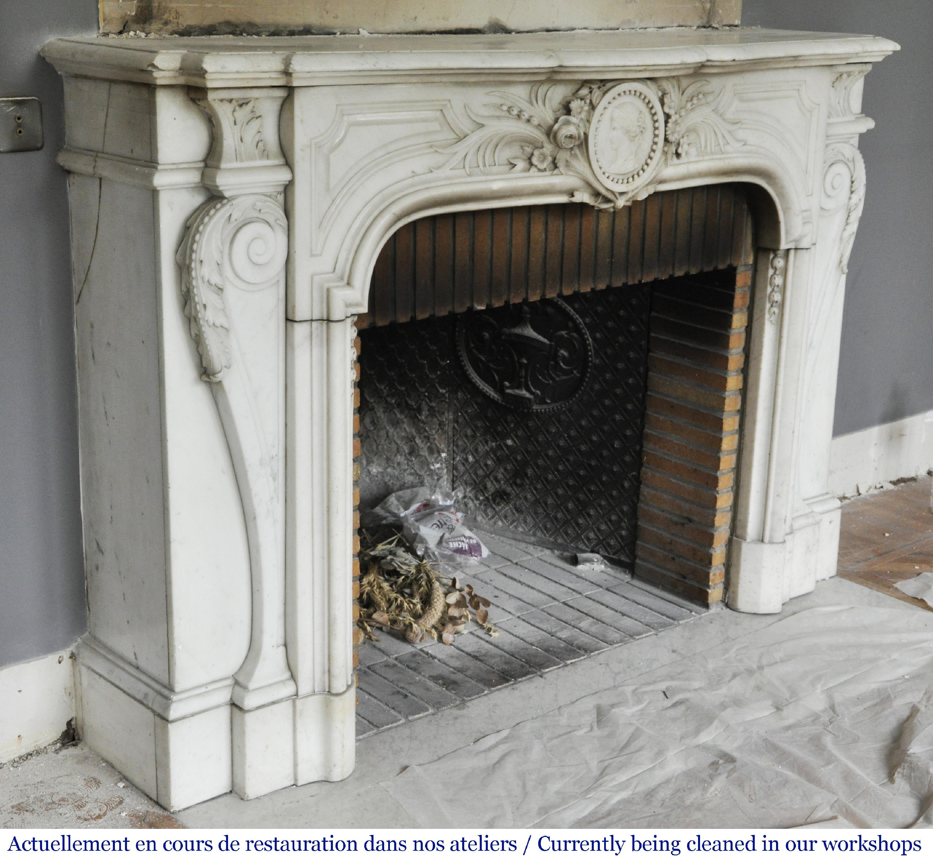 19th Century Antique Napoleon III fireplace with a woman's profile decoration in a medallion For Sale