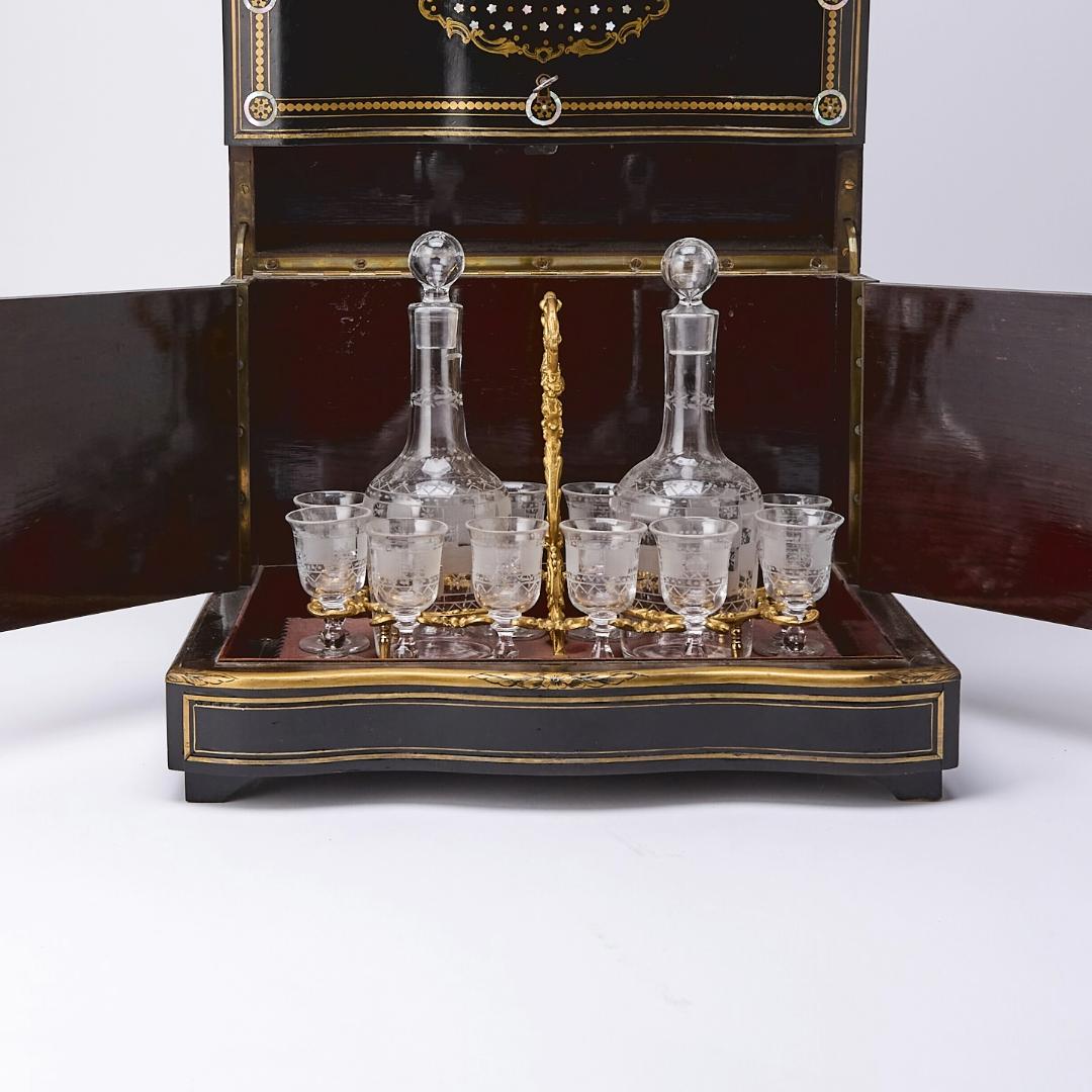 Exquisite Napoleon III cave à liqueur, crafted in France during the second quarter of the 19th century. The ebonized case is richly inlaid with brass and mother-of-pearl, showcasing refined French craftsmanship and elegant decorative design.
The