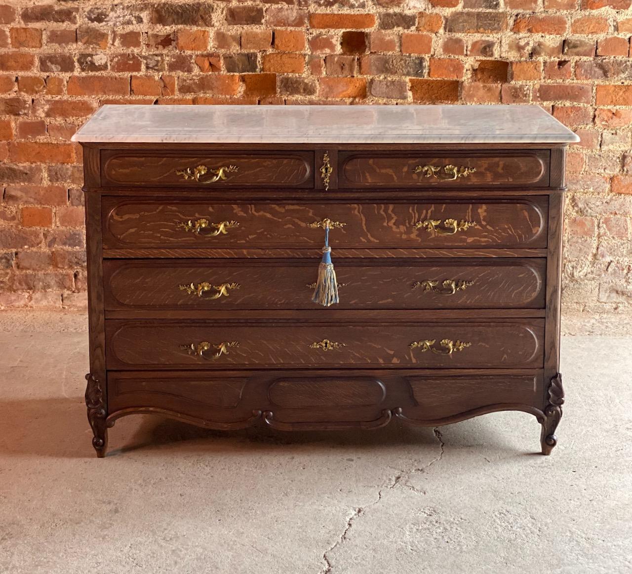 Antique Napoleon III marble commode chest of drawers, France circa 1870 Number 4

A beautiful large antique Napoleon III marble topped oak commode chest of drawers, circa 1870, this chest dates to the late 19th century from the French Parisian