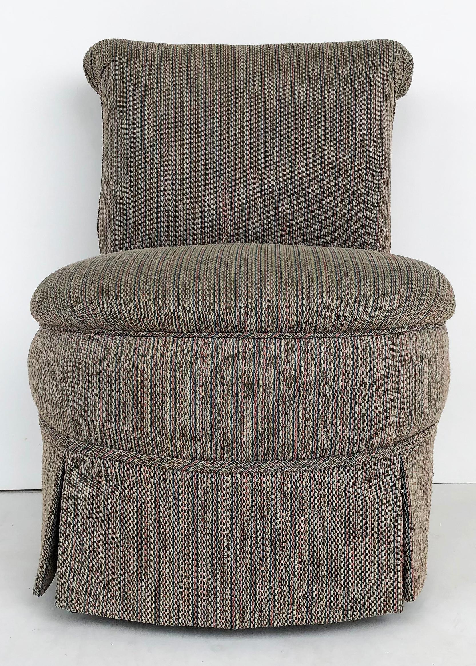 Antique Napoleon III slipper chair circa 1900, turned legs on casters 

Offered is a Napoleon III slipper chair c1900 with turned front tapering, conical legs on casters, and later upholstery. The matching settee to this chair is offered in a