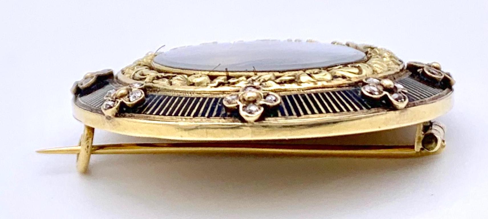 Antique memorial brooch with a pained miniature of Napoleon.
The miniature with a portrait of Napoleon in profile has been painted on card with gouache. The gold brooch is decorated with black enamelled stripes and applicated flowers set with four