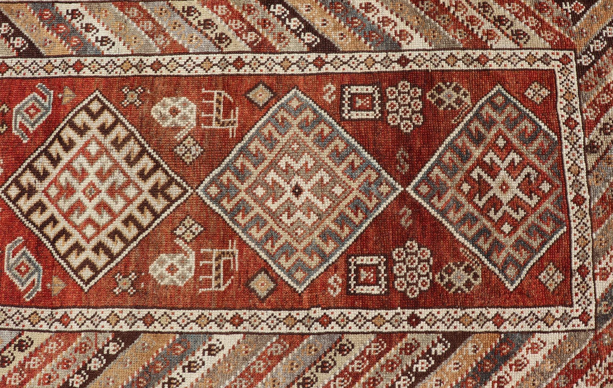 Persian Antique Narrow and Long Kurdish Runner in Wool with Medallion Tribal Design For Sale