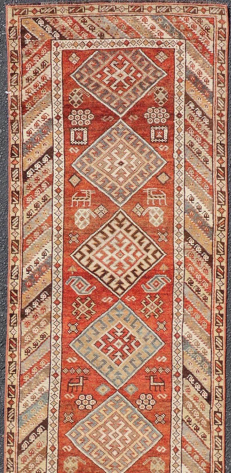 Antique Narrow and Long Kurdish Runner in Wool with Medallion Tribal Design In Good Condition For Sale In Atlanta, GA