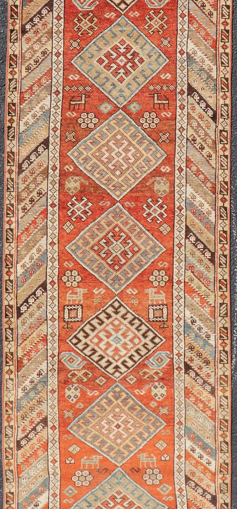 20th Century Antique Narrow and Long Kurdish Runner in Wool with Medallion Tribal Design For Sale