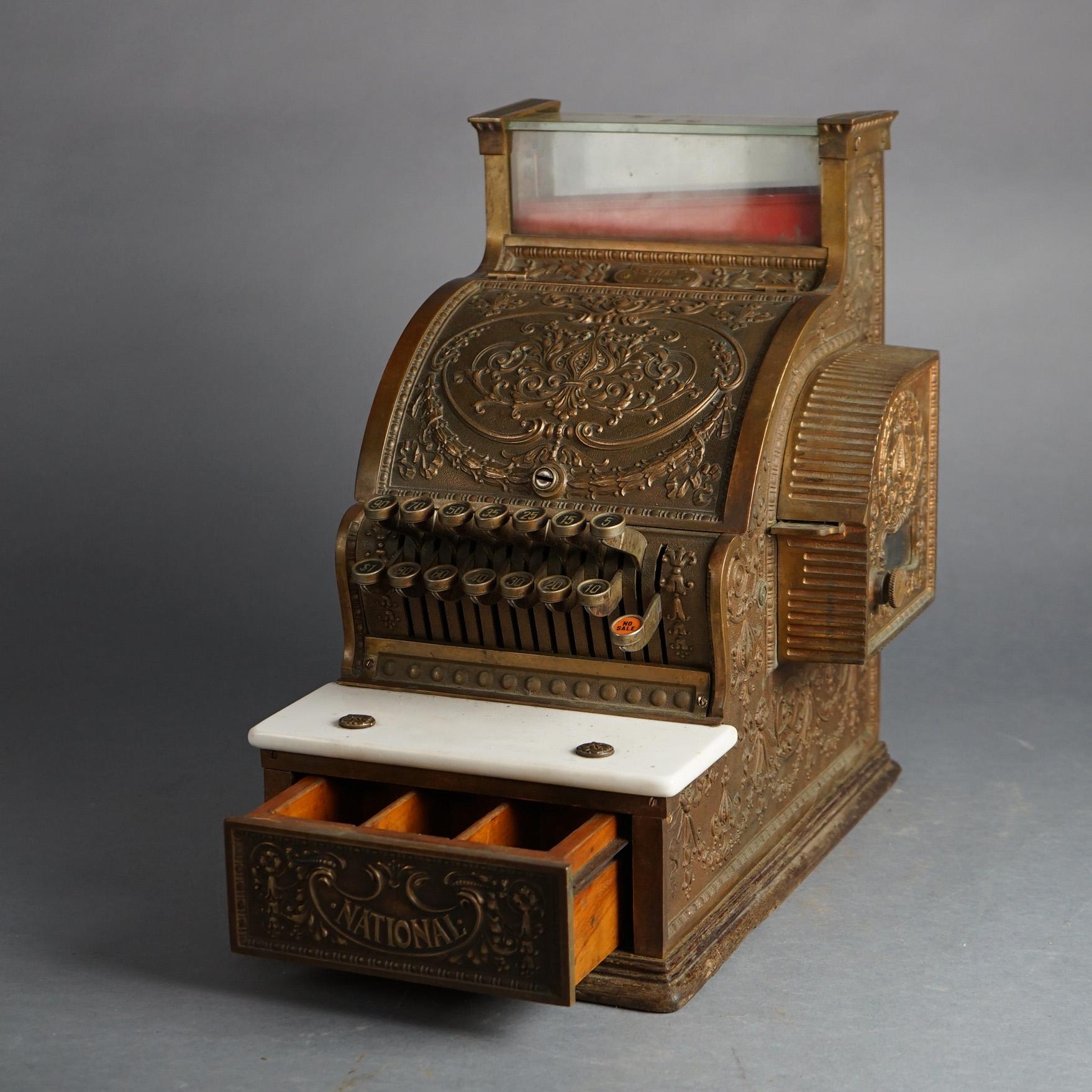 Antique National Brass Candy Store Cash Register with Foliate Embossed Case & Marble Tray Circa 1900

Measures - 17.25
