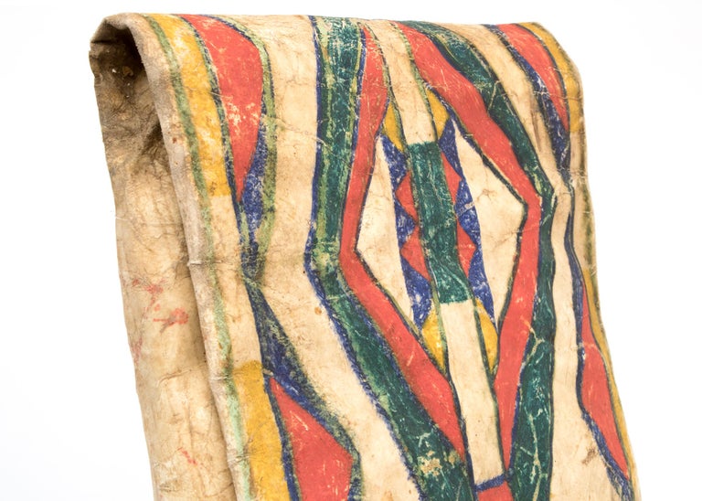 19th century vintage Native American (Plains Indian) Parfleche container in an envelope form, finely painted circa 1875-1900 in an abstract design with red, green, blue and yellow by a North American Indian artist of the Crow Tribe. Makes a stunning