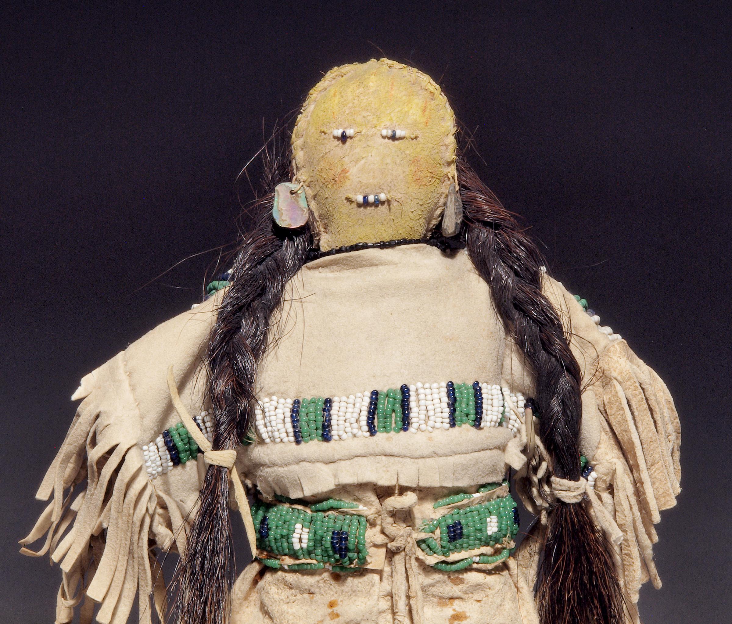 Constructed of native tanned hide with trade beads and horse hair, this doll is wearing a traditional period dress and moccasins.

A nomadic tribe, the Sioux territory included parts of present-day North and South Dakota, Wisconsin, Iowa, Minnesota,