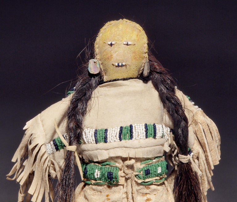 Constructed of native tanned hide with trade beads and horse hair, this doll is wearing a traditional period dress and moccasins.

A nomadic tribe, the Sioux territory included parts of present-day North and South Dakota, Wisconsin, Iowa, Minnesota,