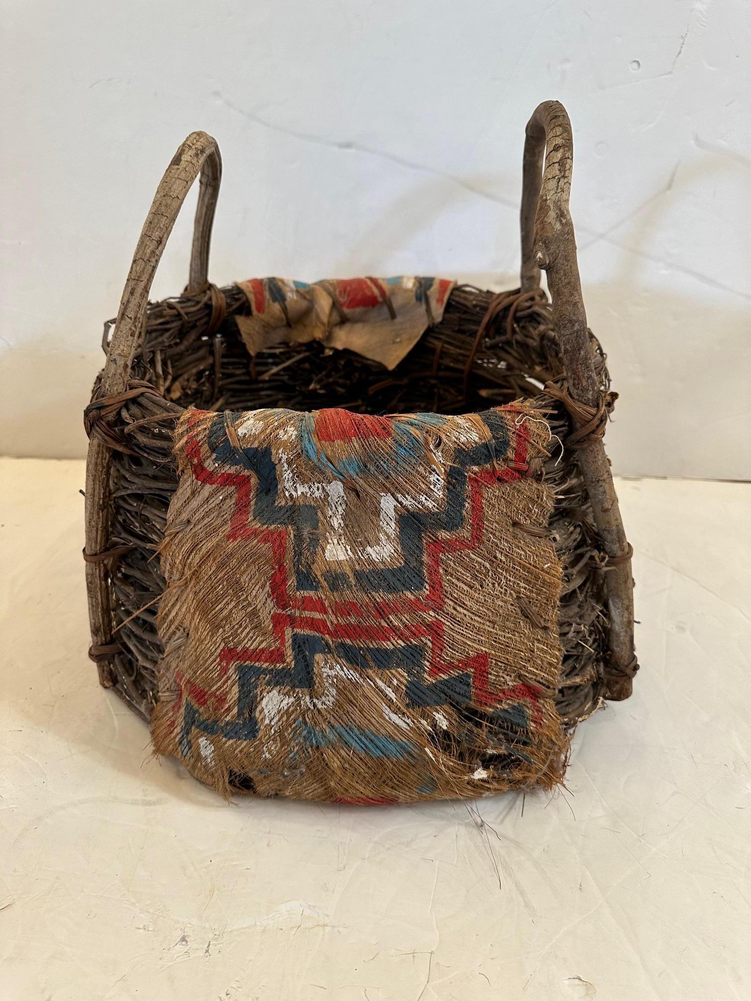 Stunning antique hand crafted Native American painted bark and twig basket having rustic bentwood handles.
Note:  Pair is available.