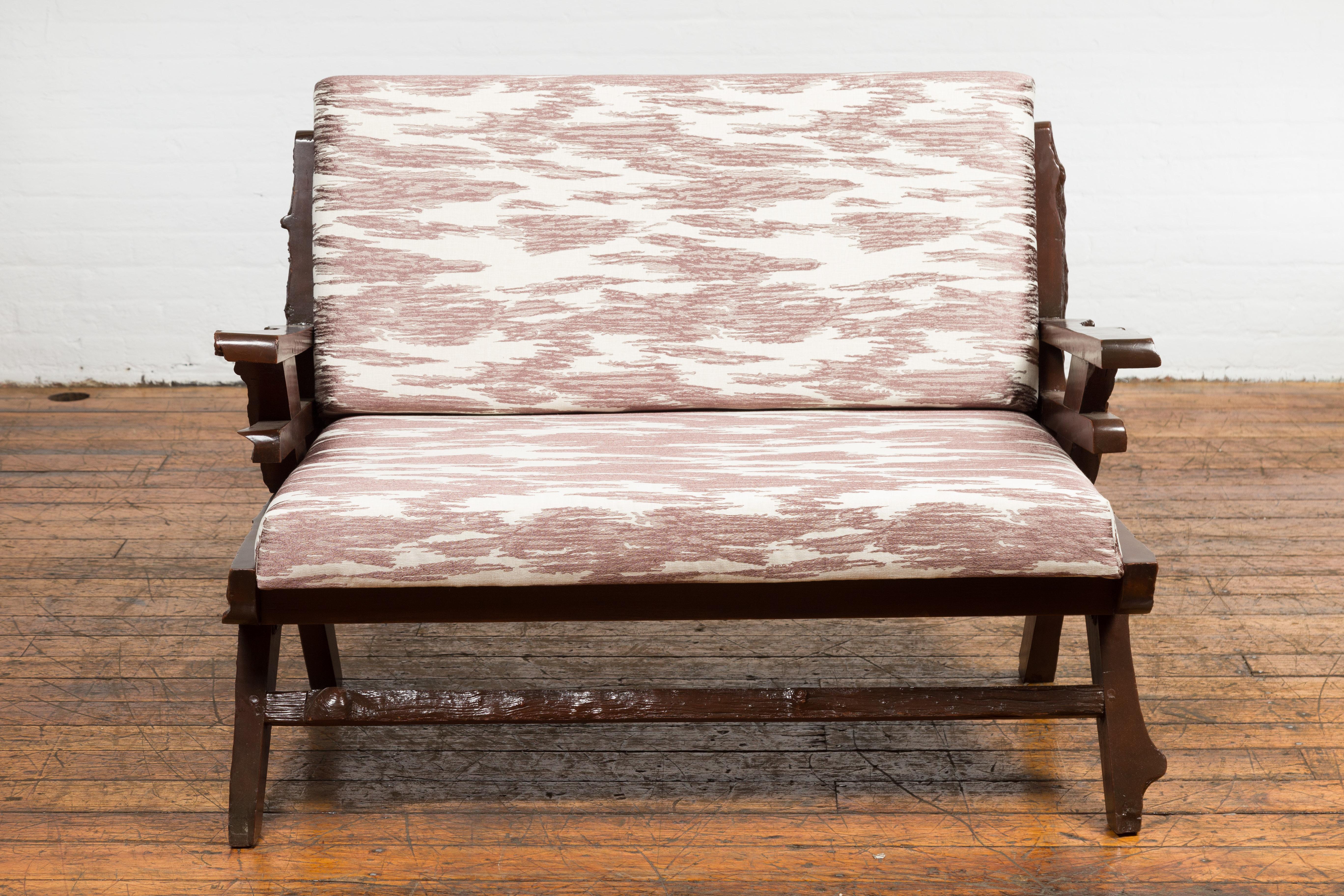 Indonesian Antique Natural Edge Settee with Custom Upholstery and Rustic Character For Sale