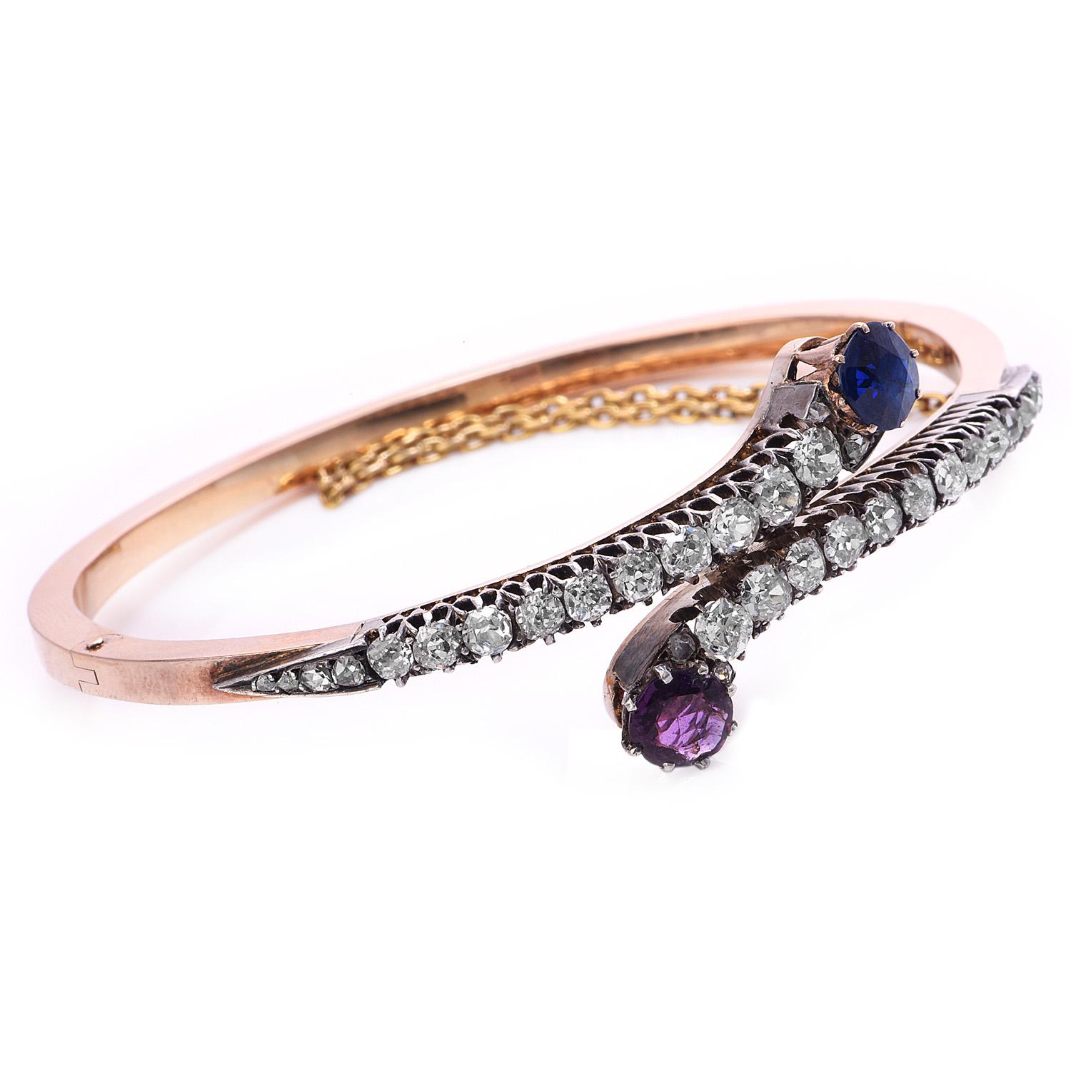 Vintage Bypass Design Vintage GIA certified Sapphire, Diamond & Ruby Bangle Bracelet,

Crafted in solid 18K rose gold, it centered with (1) square cushion-cut, prong-set, natural Ruby weighing approximately 1.00  carats & GIA certified No Heat Blue
