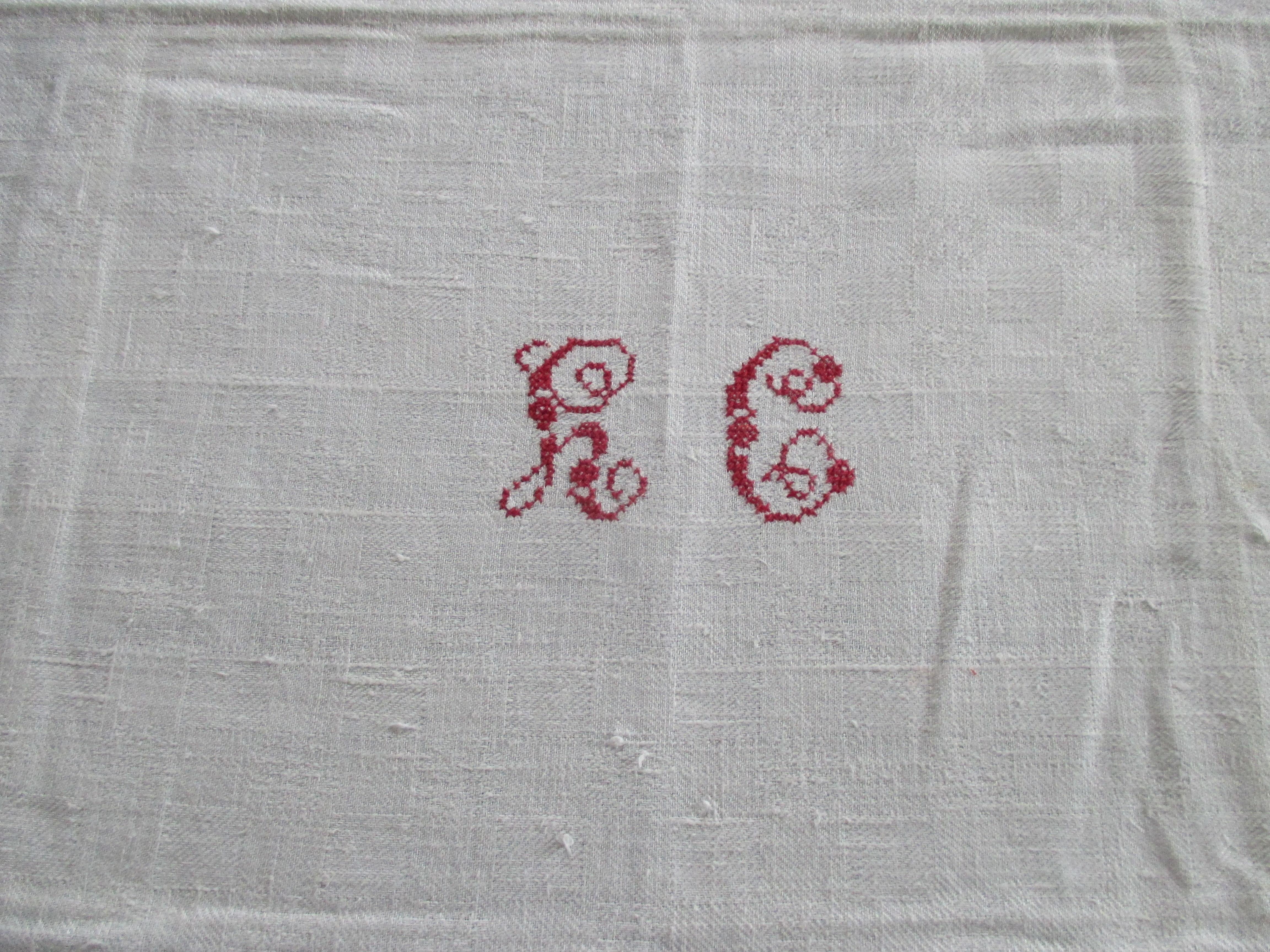 Antique natural linen embroidered textile with red letters 
