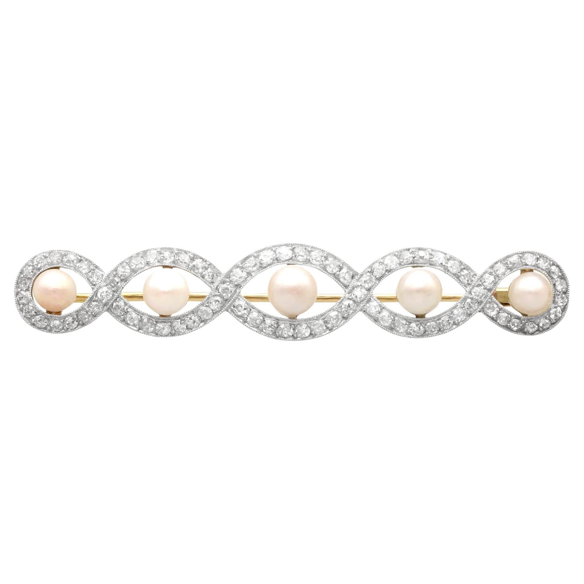 Broche antiguo de perlas naturales y diamantes en oro amarillo y platino