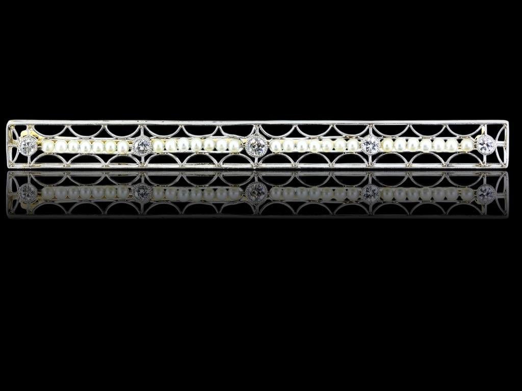28 natural seed pearls strung on wire and interspersed with 4 old cut diamonds milgrained in bezels. Just over 3 inches in length, this Edwardian pin has approximately .30 cts of diamonds.

This long antique Edwardian pin is tested to be