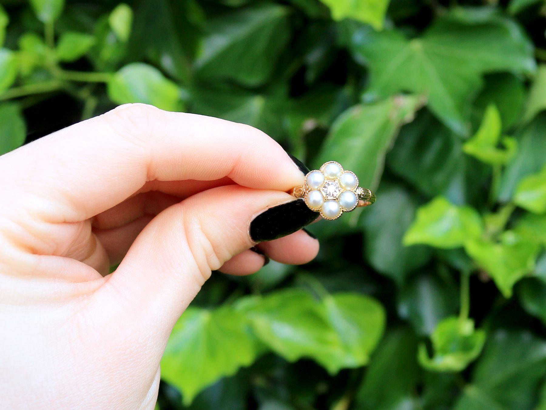 A stunning, fine and impressive natural pearl and 0.20 carat diamond, 18 karat yellow gold floral cluster ring; part of our diverse antique jewelry collections

This stunning, fine and impressive antique pearl ring has been crafted in 18k yellow